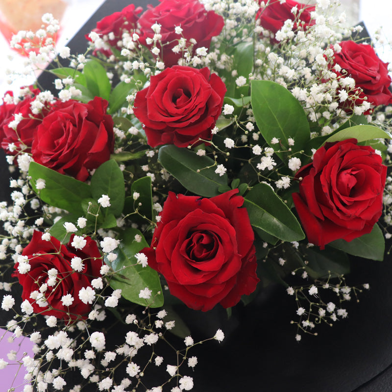 A stylish floral presentation bouquet with premium red roses, symbolizing passion and romance.