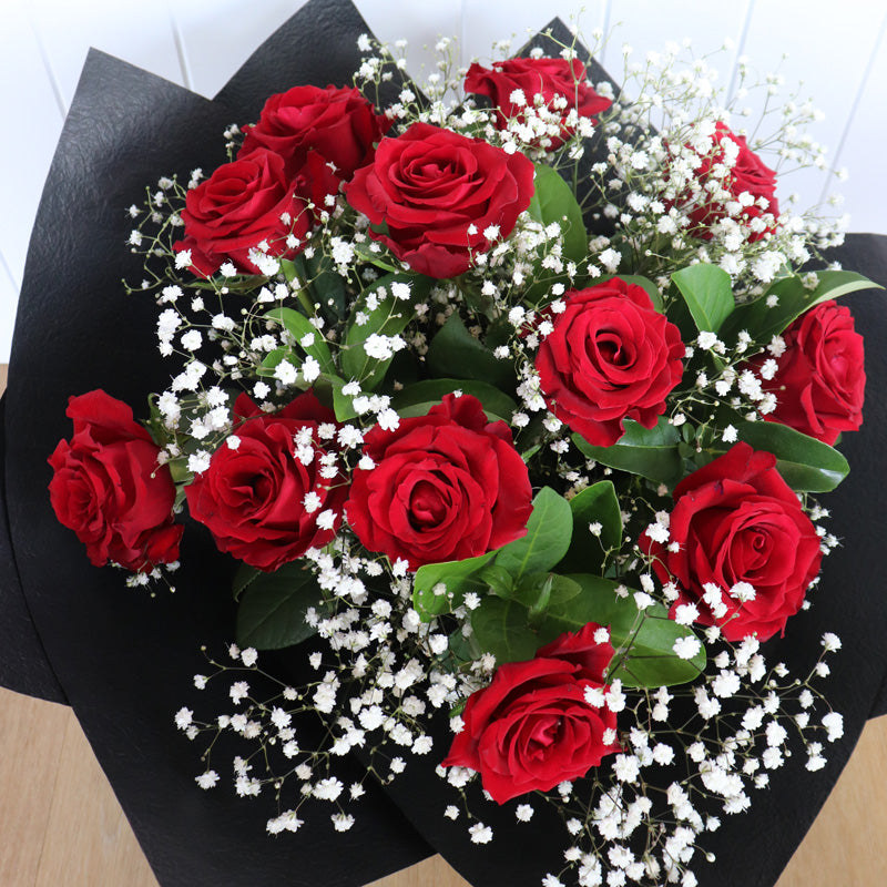 A close-up of a stunning rose arrangement in a sleek bouquet, ideal for special occasions.