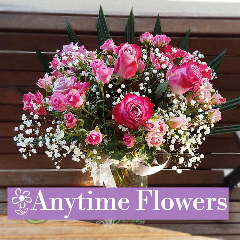 A stunning arrangement of pink roses and baby's breath. Perfect for romantic gestures and elegant occasions.