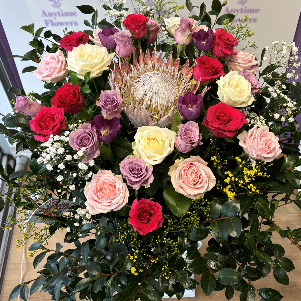 Native flower surrounded by roses