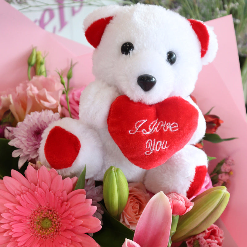I love you teddy bear in a bunch of flowers