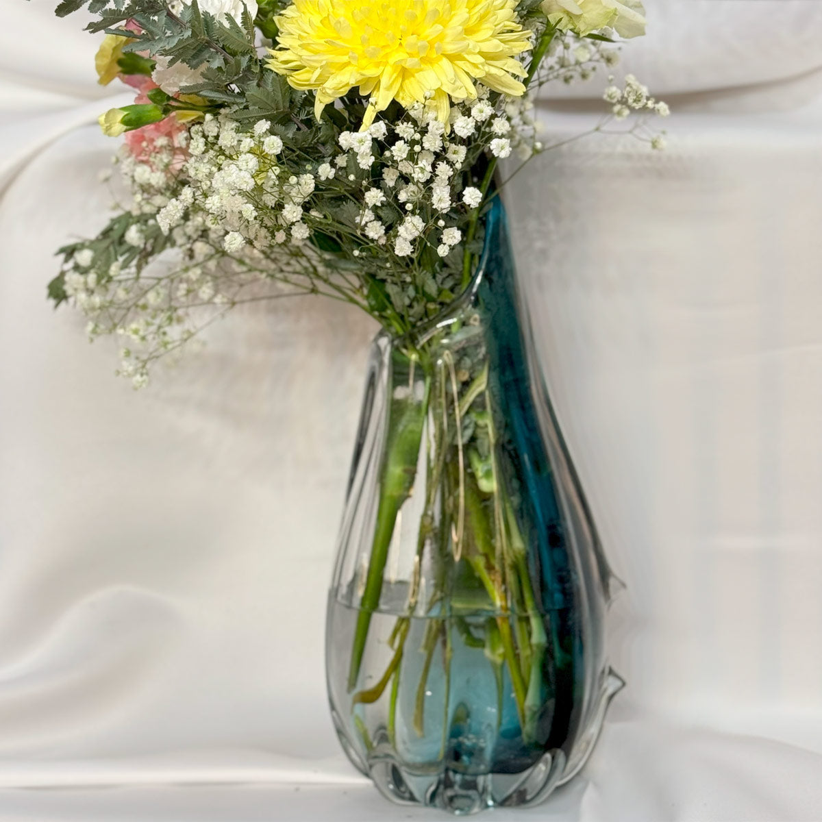 Hand blown glass vase with flowers