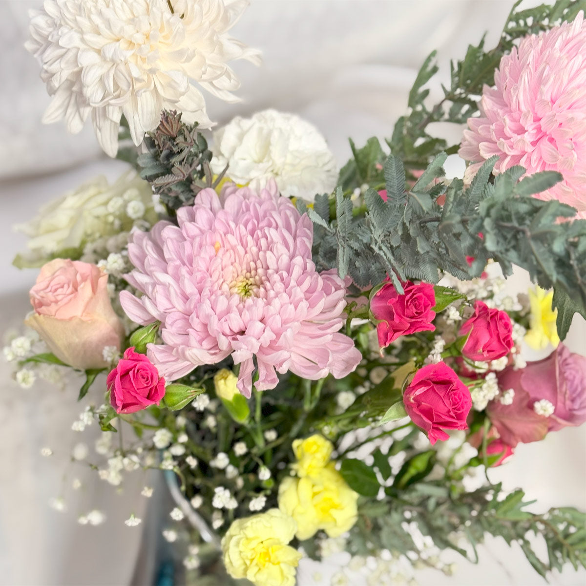 Chrysanthemums, roses and carnations