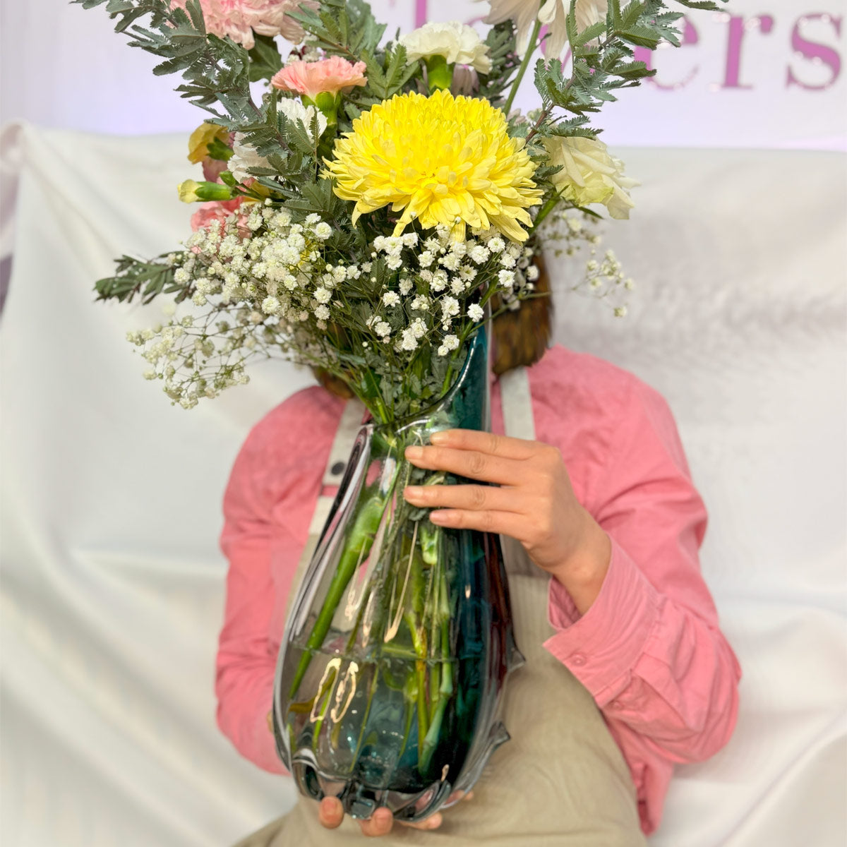 Hand blown glass vase with Chrysanthemums, roses and carnations
