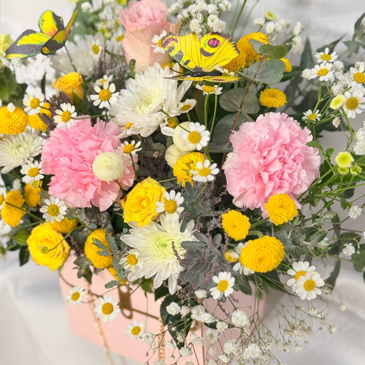 Butterfly garden flower arrangement in handbag box