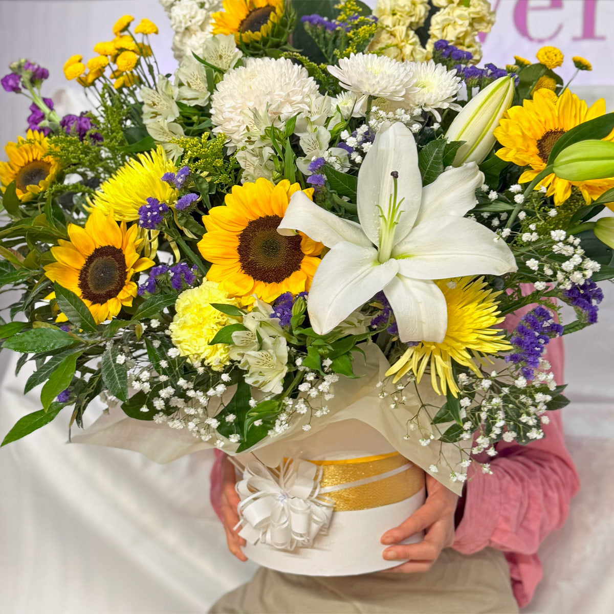 Sunflowers, chrysanthemums and lilies in a bright arrangement